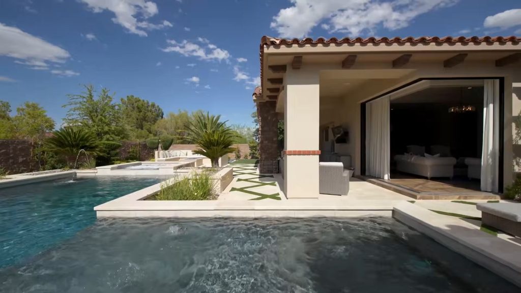 Pool and covered patio at a Mediterranean estate in Southern Highlands, Las Vegas